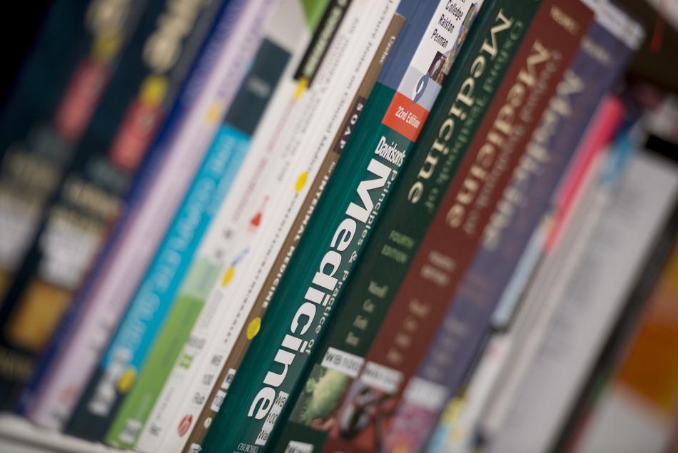 books on the shelf at the university, close-up