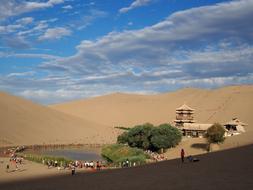beautiful lake with a house in the desert