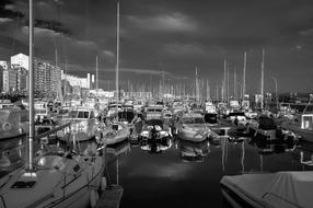 Black And White photo of boats in harbour