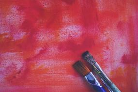 red background with brushes