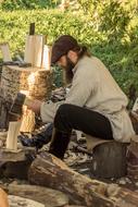 man is chopping wood