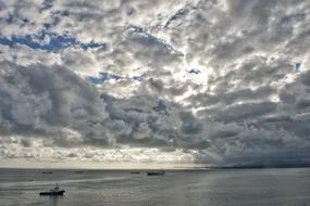 sea view with ships and clouds
