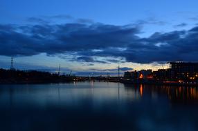 blue clouds above city on seaside at dusk, finland, Helsinki