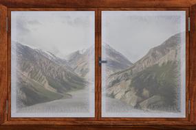 wooden frame window with a view of the mountains