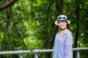 Girl wearing white hat in Forest