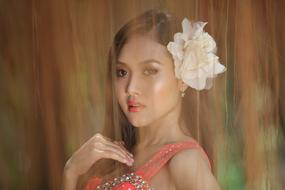 Portrait of the Asian woman with white flower on the head in Indonesia