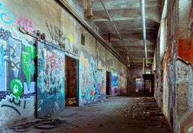 graffiti in the hallway of an abandoned factory
