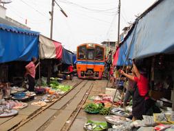 train passing by the indian market
