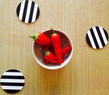 red pepper in mug on the table