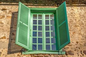 green window shutters in a rural house