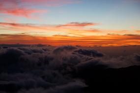 soft clouds in the orange sky