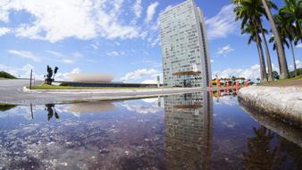 Beautiful National Congress building in Brasilia, Brazil, near the green palm trees