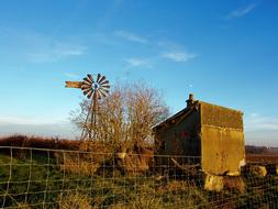old windmill in a field
