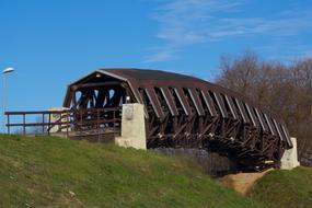 brown bridge with tunnel