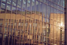 old building mirroring on modern facade