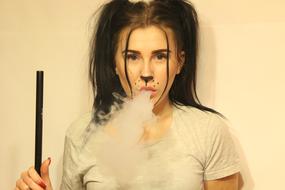 Girl with painted face Smoking Hookah