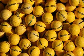 lot of yellow balloons with a signature