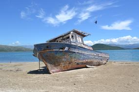 rusty old ship on the beach