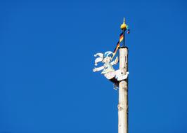 colorful pole with a jester