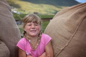 girl in pink and bags