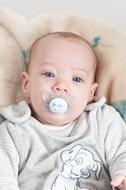 caucasian Baby with pacifier in mouth