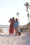 Family with two kids on tropical seaside