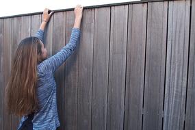 Girl Long Hair and wood fence