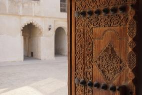 carved door of an arab house in bahrain