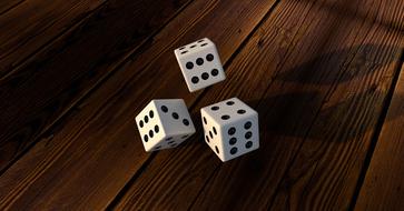 dice on a wooden table