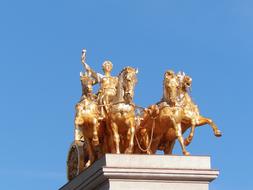 golden sculpture of a chariot on a castle in Barcelona