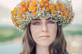 beautiful girl with a wreath on her head