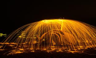 orange sparks of light in the night