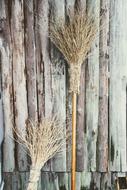 hand broom on a wooden wall