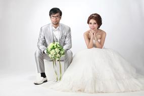 cool Wedding couple posing in studio