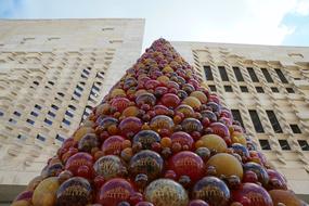 high conical pile of Colorful Mdina Glass at facade, malta, valetta