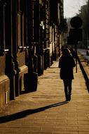 Girl walking on old Street at Evening