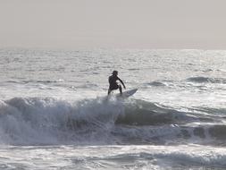 Surfer conquers a wave