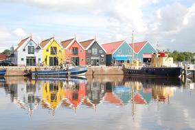 colorful fishing houses on the lake
