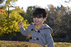 a happy baby in the woods