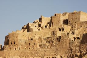 Splendid cave houses at blue sky background in Tunisia