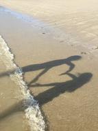 cute couple by the sea on the beach