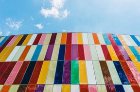 tiles of different colors on a blue sky background