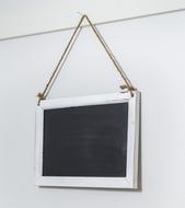 white school board hanging on the wall