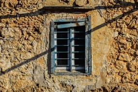 vertical bars on the window of an old building in Cyprus