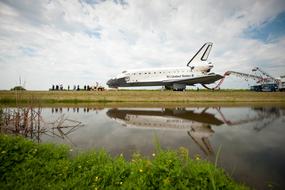white plane by the lake