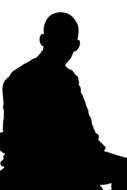 black silhouette of a sitting man