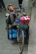 Man Sleep China street