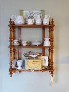 wooden shelf with a beautiful ceramic set