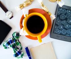 yellow coffee mug on the desktop