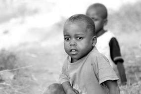 black and white photo of children outdoors in Uganda, Africa